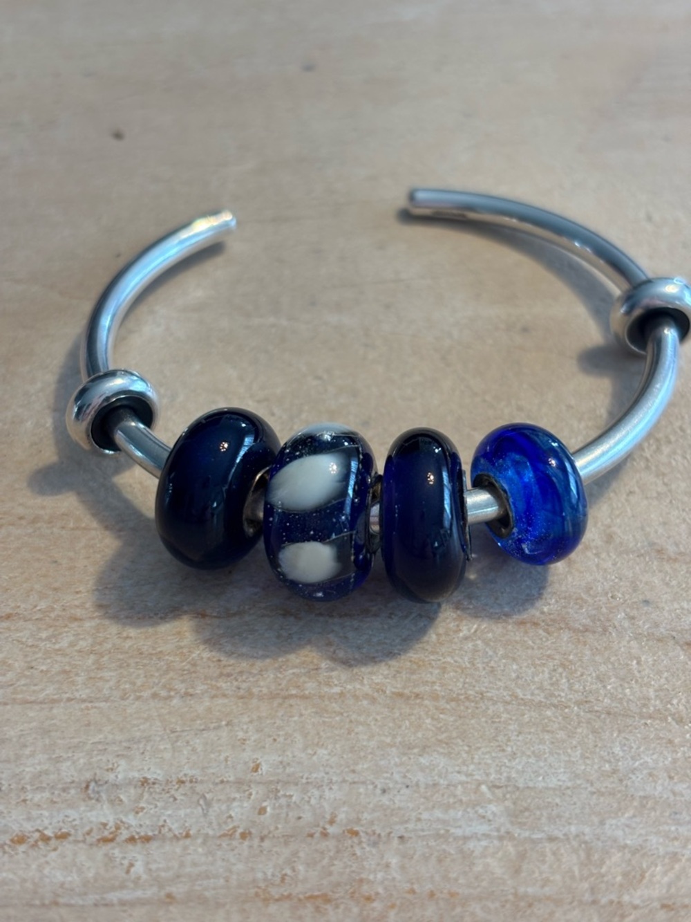 Glass beads with sterling silver core.